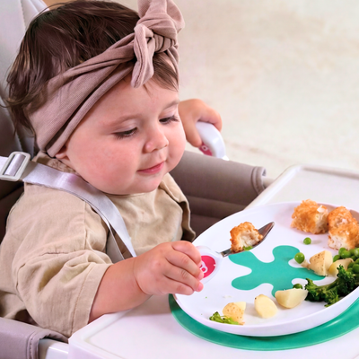 toddler eating with doddl spoon and suction plate