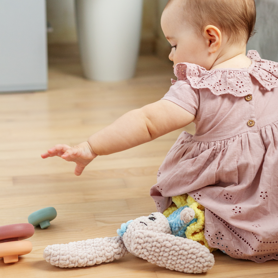 A baby reaching for an object