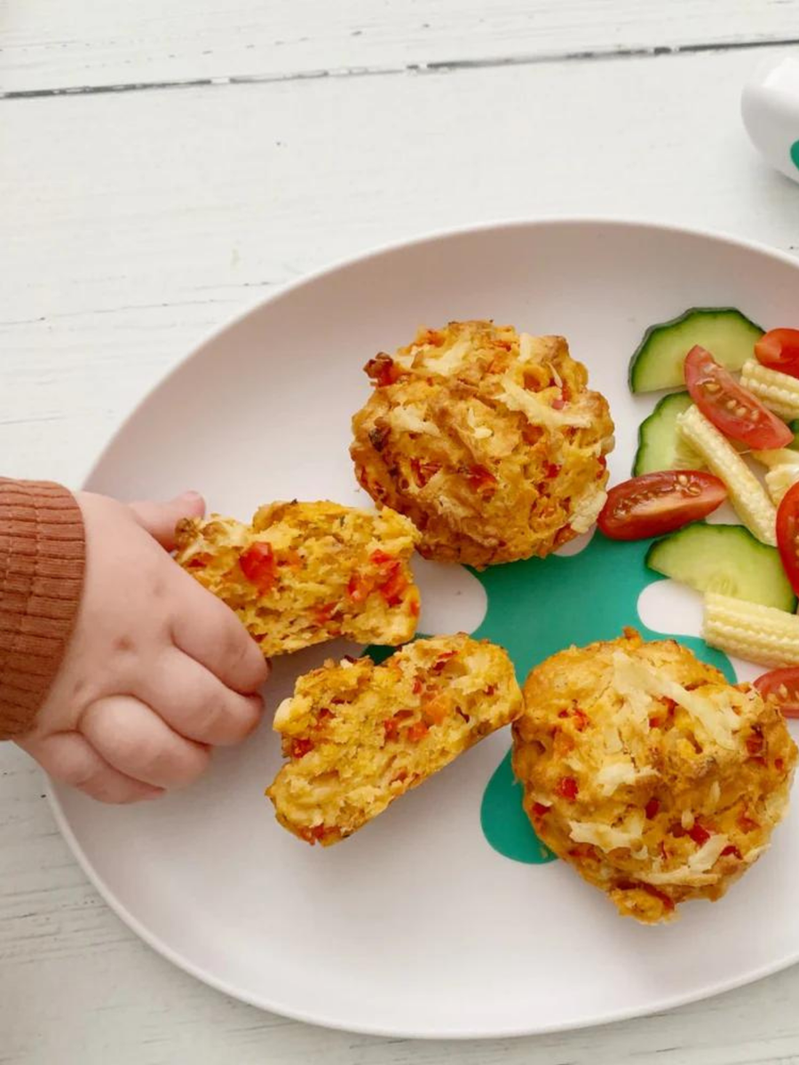 A baby eating finger food